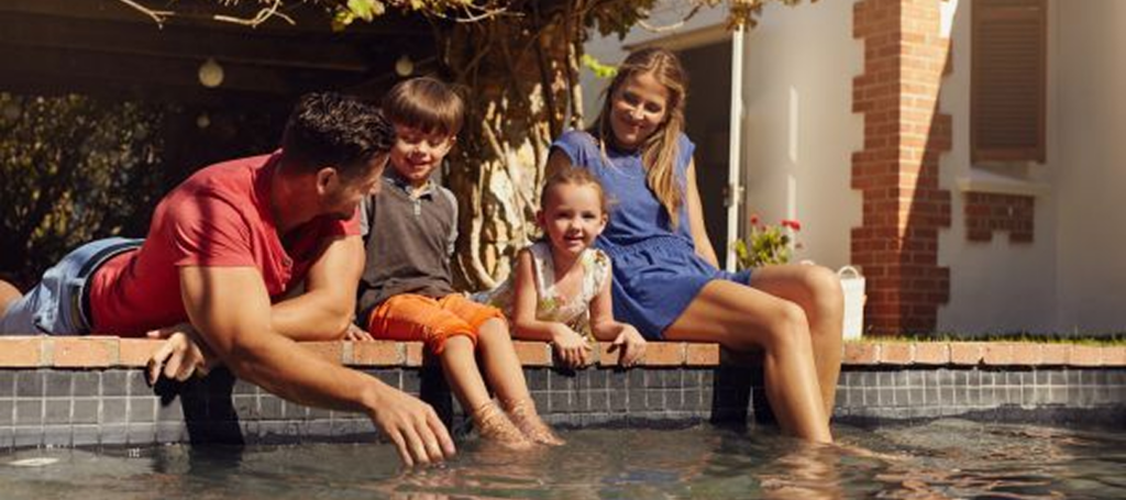 happy family hanging near pool
